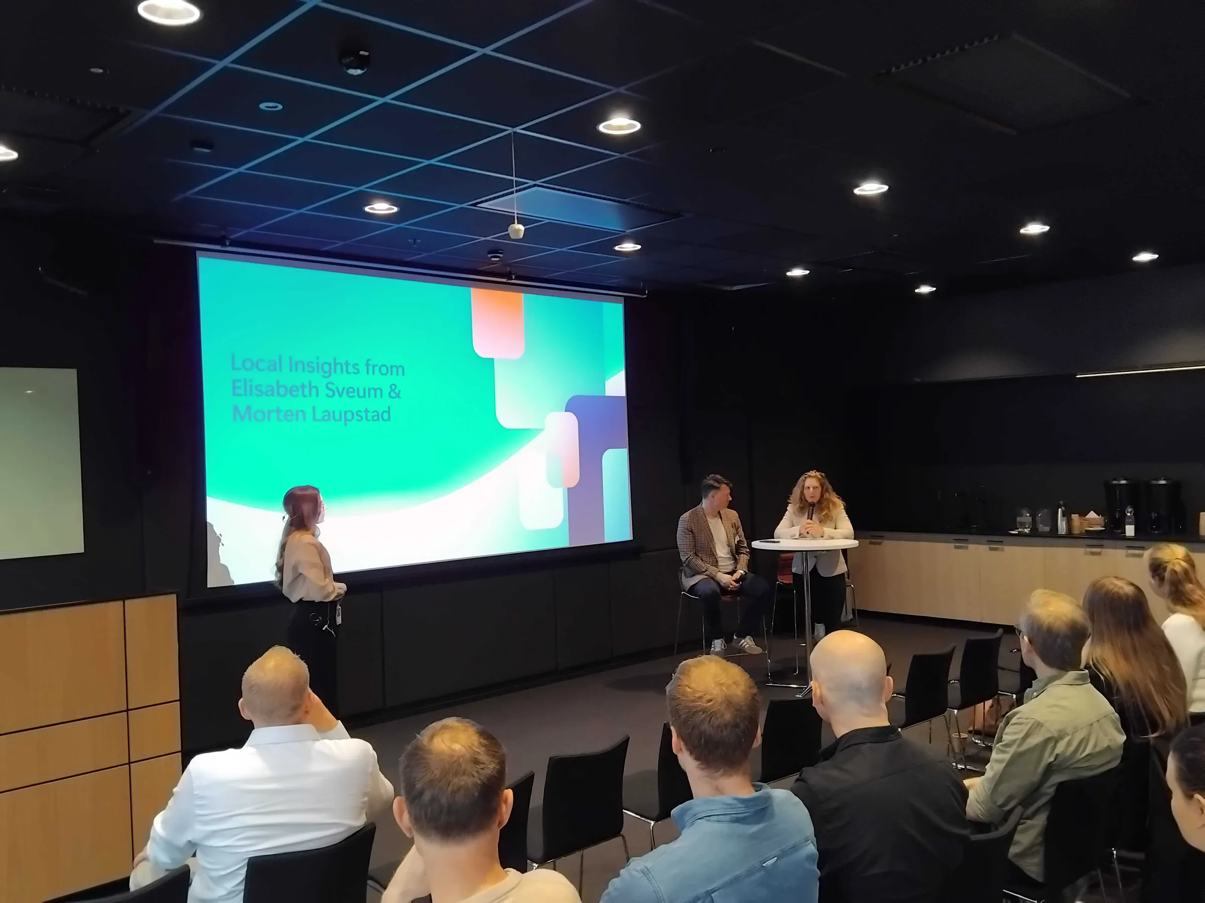 A panel on stage during an AI seminar at Microsoft